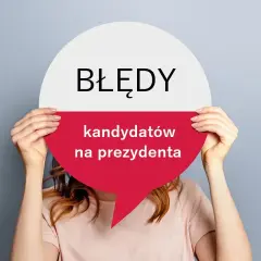 Osoba trzyma okrągły znak z napisem "BŁĘDY kandydatów na prezydenta". Czy to błędy, niekoniecznie?